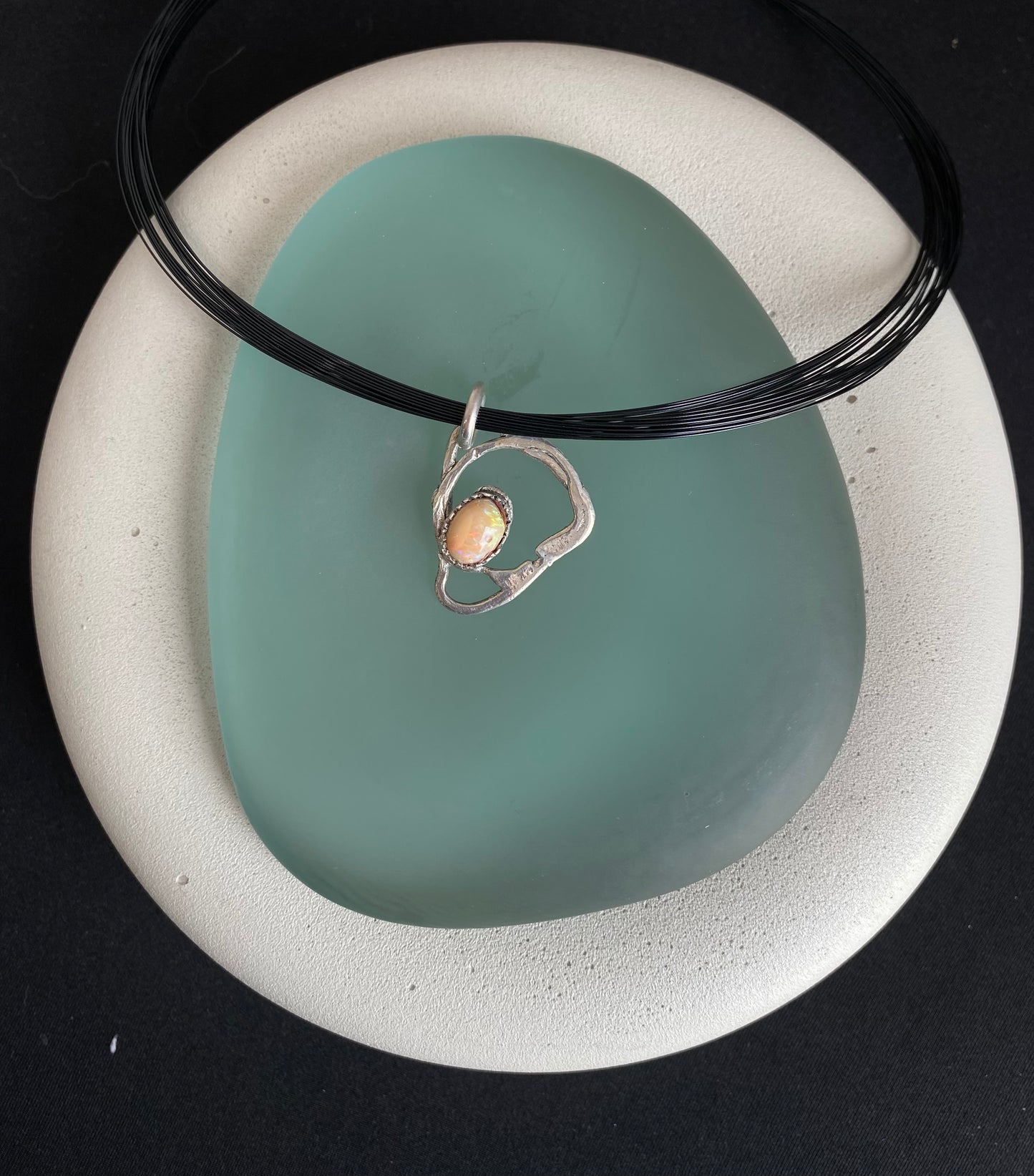Free form silver and opal pendant