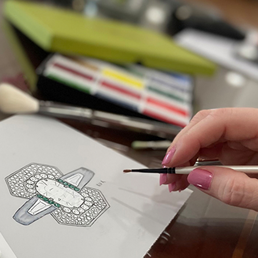Kerri, owner of The Jewelers Vault, drawing and painting a custom diamond cocktail ring