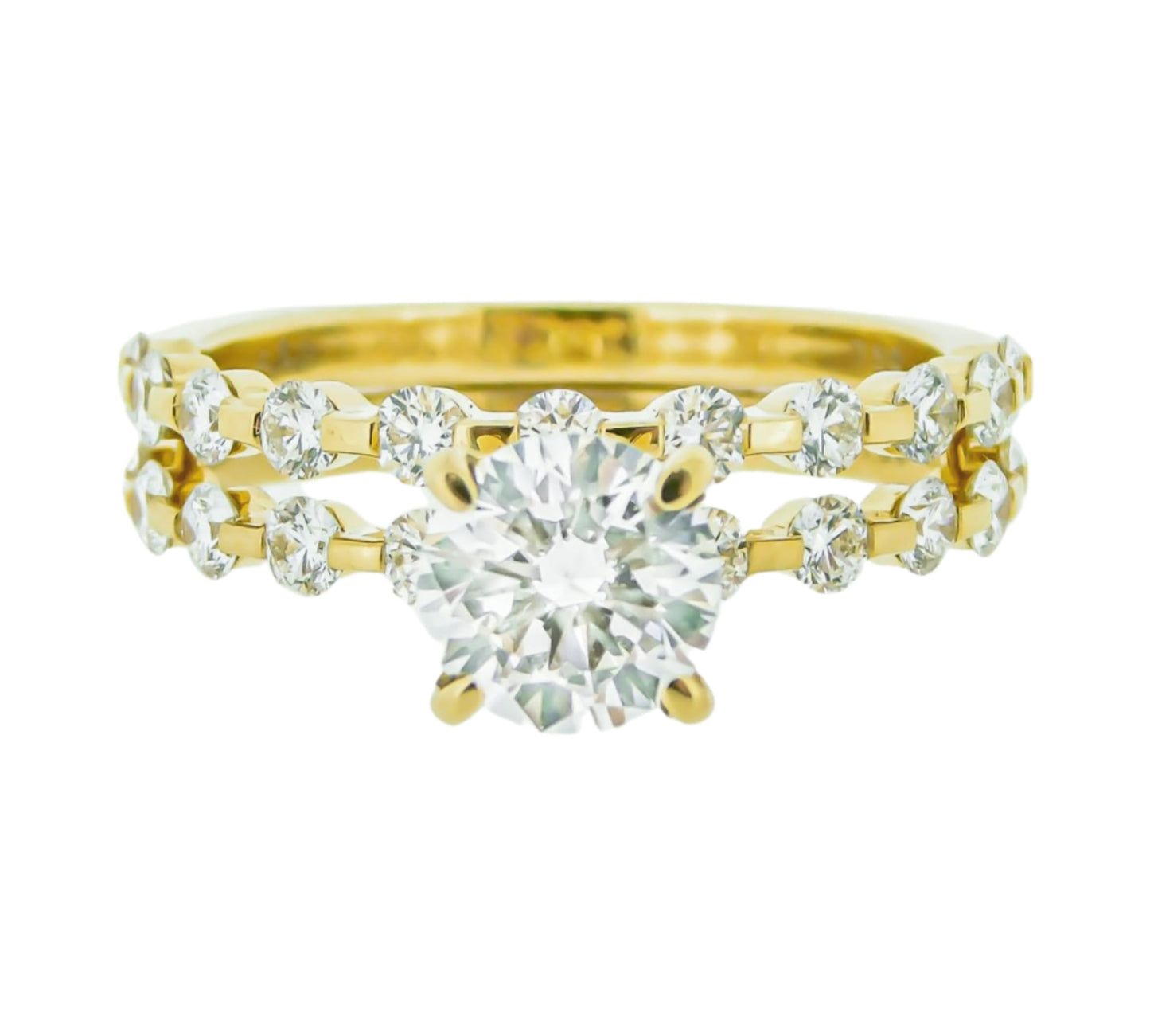 yellow gold engagement ring set.  Round center with smaller floating diamonds.
