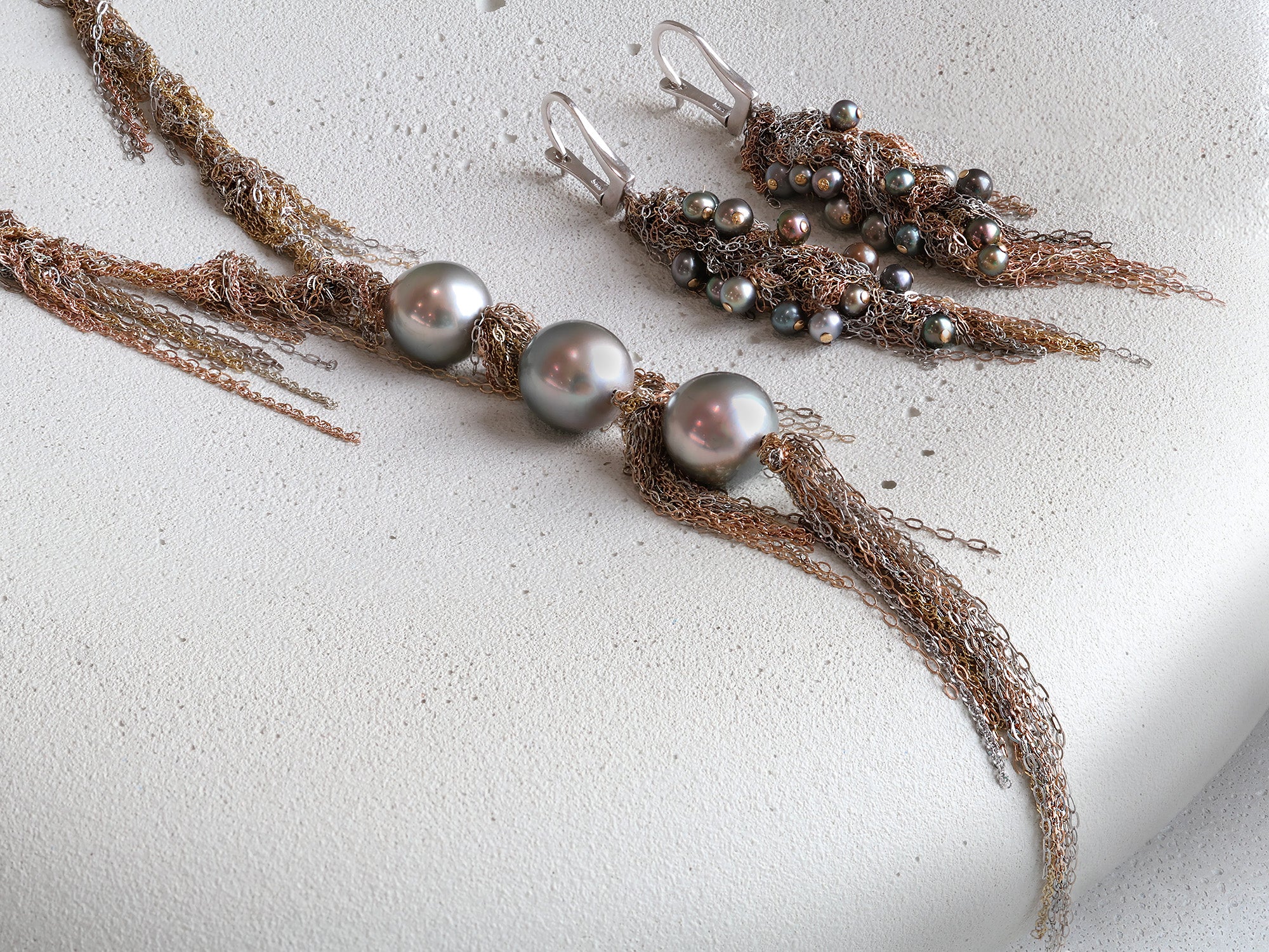 Martin Bernstein's fringed gold chain necklace and earrings with Tahitian pearls scattered throughout.